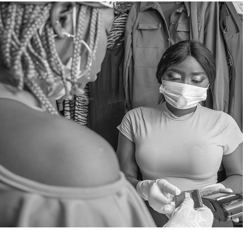 Retail team processing a customer transaction at a boutique.